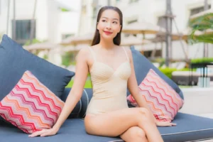 portrait beautiful young asian woman relax smile around outdoor swimming pool hotel resort