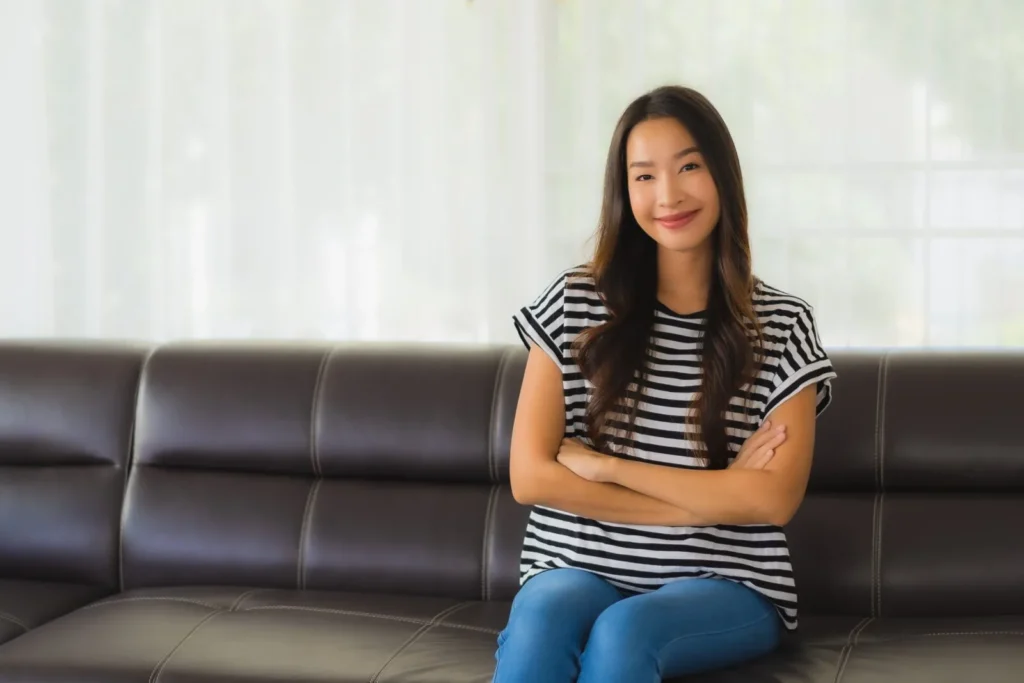 portrait beautiful young asian woman relaxes sofa living room