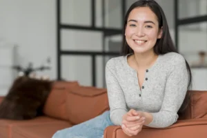 young woman sitting couch